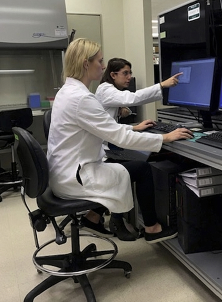 GeNovu team member working with a scientist